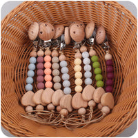 Thumbnail for Ecotoys CozyClip™ | Sicher & stilvoll - Holz-Schnullerkette für Babys