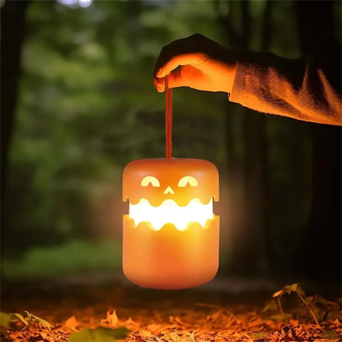 SpookyLight LED-pompoen-lamp met vriendelijk gezicht, oranje gloed, draagkoord — veilig speelgoed voor kinderen